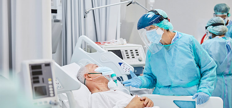 acute care nurse with patient 750x350 1